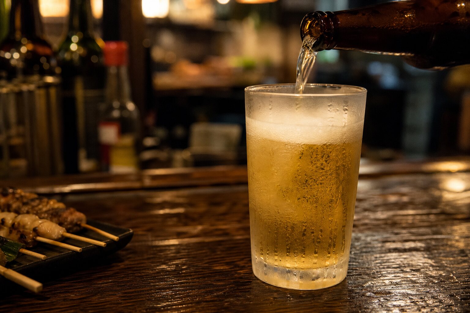 A cold lager being poured at the bar