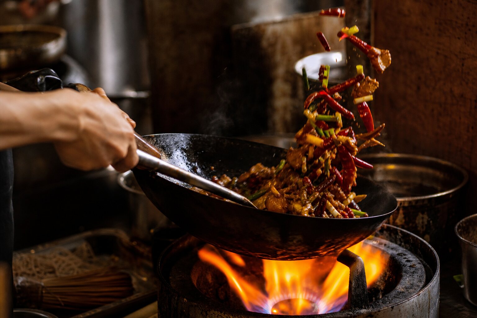 A Sichuan stir fry going through the wok